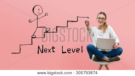 Next Level Concept With Young Woman Using Her Laptop