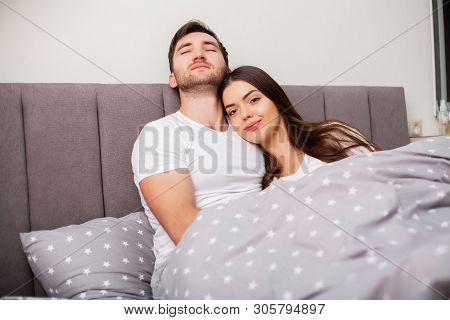 Happy Couple Having Fun In Bed. Intimate Sensual Young Couple In Bedroom Enjoying Each Other