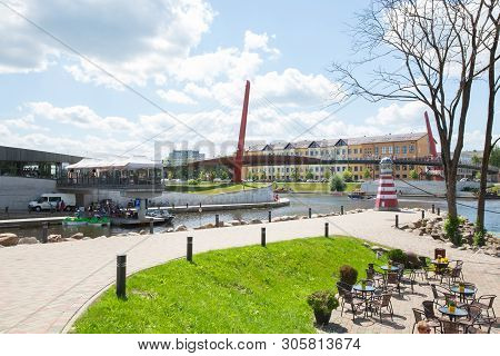 City Jelgava, Latvian Republic. River Lielupe, Peoples And Urban City View. Houses And Walking Paths