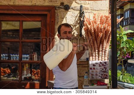 Antalya, Turkey - May 19, 2019: The Ice Cream Seller Is Spinning Ice Cream On A Stick.