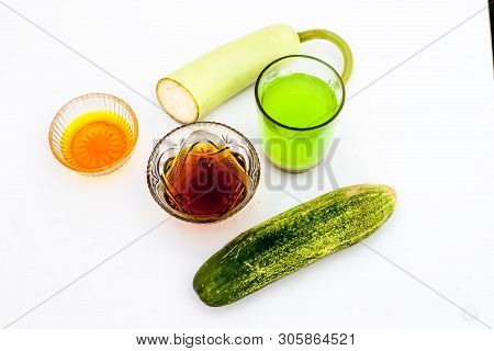 Bottle Gourd Face Pack Isolated On White I.e. Bottle Gourd Or Lauki Juice Well Mixed With Cucumber,