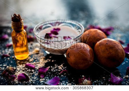 Perfect Remedy For Dry Feet On Wooden Surface I.e. Chikoo Pulp In A Bowl Well Mixed With Castor Oil