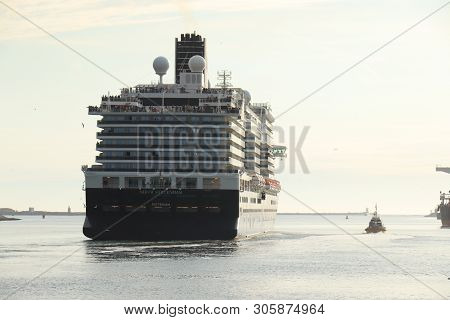 Ijmuiden, The Netherlands -june, 9th 2019: Nieuw Statendam Leaving Ijmuiden Sea Lock, Joined By Pilo