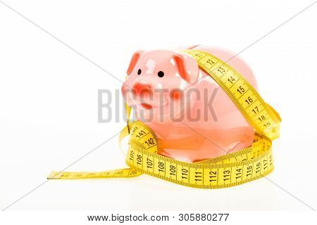 Credit Loan Debt. Measure Costs. Piggy Bank And Measuring Tape. Budget Limit Concept. Economics And 