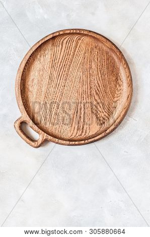 Empty Round Wooden Dish On Grey Concrete Background, Copy Space For Your Text