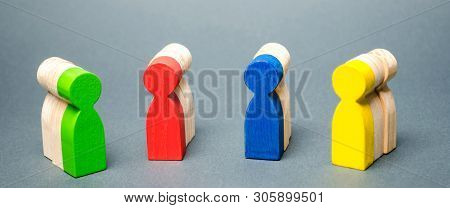 Groups Of Multicolored Wooden People. The Concept Of Market Segmentation. Customer Relationship Mana