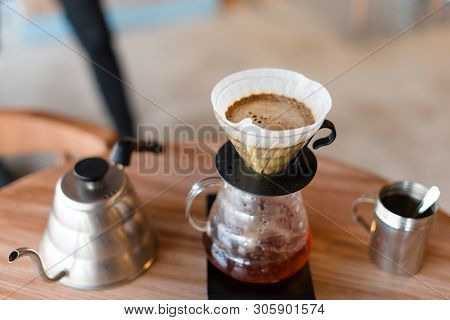 Closeup Of Coffee Brewing Gadgets On Wooden Table In Cafe. Drip Brewing, Filtered Coffee, Or Pour-ov