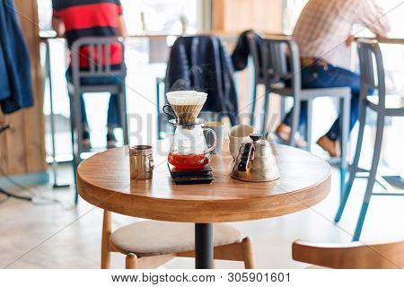 Closeup Of Coffee Brewing Gadgets On Wooden Table In Cafe. Drip Brewing, Filtered Coffee, Or Pour-ov