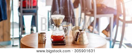 Closeup Of Coffee Brewing Gadgets On Wooden Table In Cafe. Drip Brewing, Filtered Coffee, Or Pour-ov