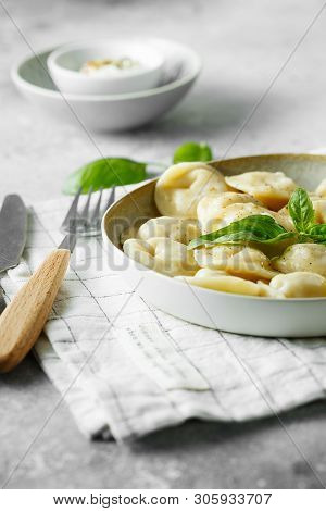 Meat Dumplings - Russian Pelmeni, Ravioli With Meat On A White Plate.