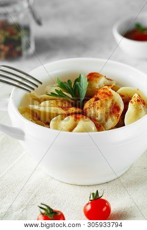 Meat Dumplings - Russian Pelmeni, Ravioli With Meat On A White Bowl.