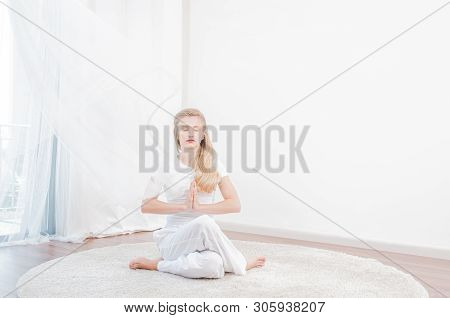 Yoga Time. Beautiful Woman Is Practicing Yoga At Home, Girl Doing Gomukasana Exercise, Sitting In Co