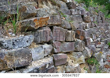 Drystone Wall Of Irregular Shaped Limestone Blocks In A Garden