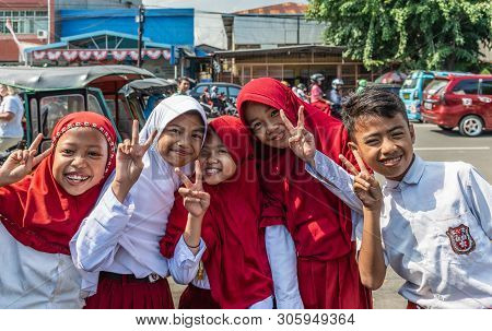 Makassar, Sulawesi, Indonesia - February 28, 2019: Terong Street Market. Closeup Of Group Of Young M