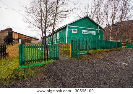 Esso, Kamchatka Peninsula, Russia- 02 October 2014: Wooden, Rural, Green Pharmacy Building With Gree