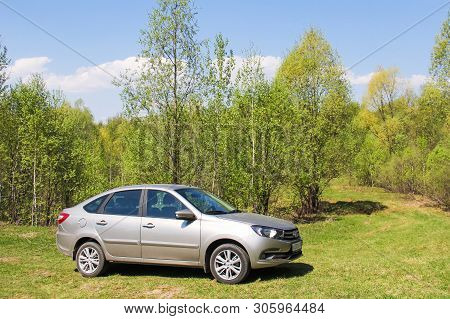 Asha, Russia - May 10, 2019: Grey Motor Car Lada Granta At The Countryside.