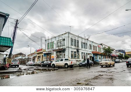 Akhalkalaki, Georgia - May 9, 2017. Main Road Of City With Broken Asphalt