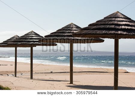 Thatched Roof Beach Palapas On Hot Summer Day, Mossel Bay, South Africa
