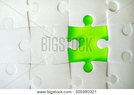 Multiple White Puzzle Pieces Put Together Without One Piece. View From Above. Close Up Image.