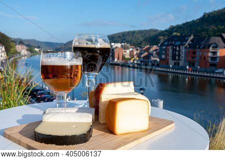 Glass Of Belgian Abbey Beer And Tasting Of Cheeses Made With Trappist Beer And Fine Herbs With View