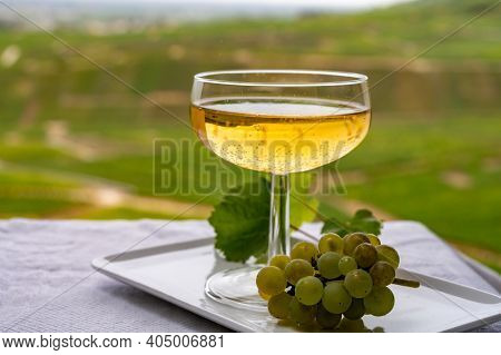 Tasting Of French Sparkling White Wine With Bubbles Champagne On Outdoor Terrace With View On Green 