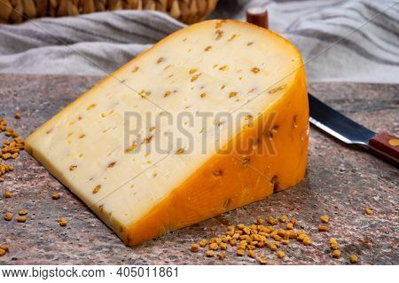Cheese Collection, Piece Of Hard Yellow Dutch Gouda Cheese With Dried Fenugreek Seeds