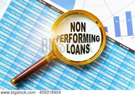 Finance And Business Concept. Financial Reports, Charts And A Magnifying Glass Are On The Table. Ins