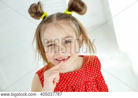 Little Girl Has No Tooth. The Child Has Lost A Baby Tooth. High Quality Photo