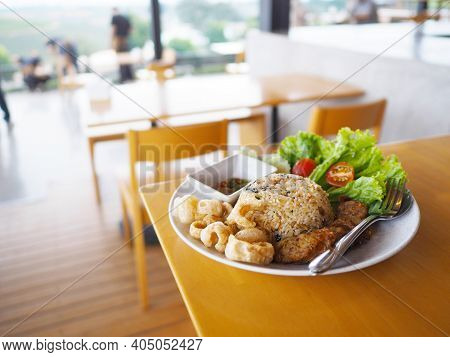 Close Up Fried Rice With Notrhern Thai Spicy Sausage , Pork Snack And Fresh Vegetables On White Plat