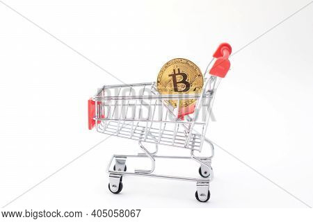 Goolden Bitcoin Coin In Toys Shopping Cart.