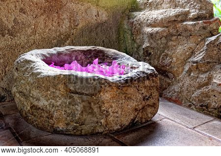 Stone Church Holy Water Stoup With Pink Flowers In
