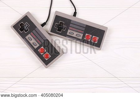Kharkov, Ukraine - December 27, 2020: Two Old Gamepads For 8-bit Video Game Consoles Nintendo Entert