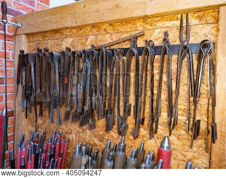 The Rack With Glassblowing Pliers And Shaping Scissors. Necessary Tools In Traditional Czech Hand Gl