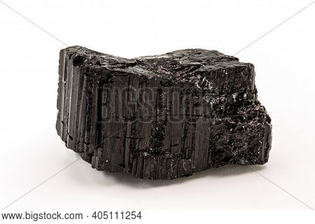 Extreme Close-up Of Black Tourmaline Mineral Isolated Over White Background