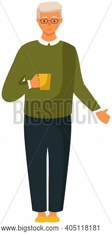 Smiling Elderly Man Wearing A Sweater And A Shirt Standing At Full Height With A Cup Of Coffee In Ha