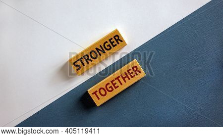 Stronger Together Symbol. Concept Words 'stronger Together' On Wooden Blocks On A Beautiful White An