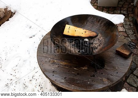 Grill With Burnt Wood. Against The Background Of Snow. Bonfire Concept In Recreation Area. High Qual
