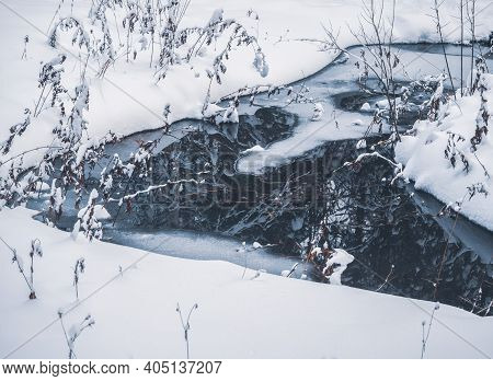 Green Wellspring, The Source Of Natural Mineral Water In The Forest Of Mari El, Russia, Winter Natur