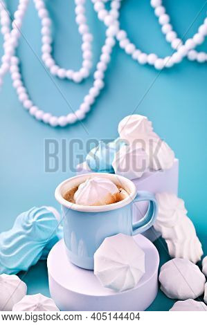 Espresso Cup With Foam, Meringues Of Different Colors On A Blue Background. Meringue. A Creative Sho