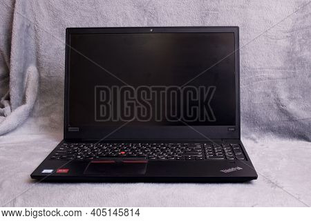 Belarus, Novopolotsk - 26 January, 2021: Black Lenovo Laptop On A Gray Background
