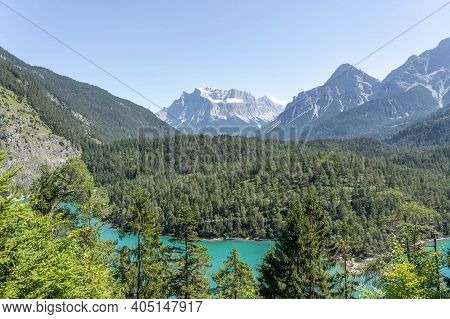 West Side View Of Snowy Zugspitze From Fernpass Austria Blindsee Lake