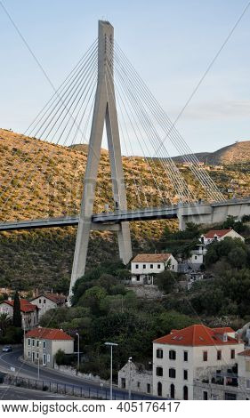 Modern Cable Stay Bridge Towers Over Old Buildings In Gruz, Croatia.