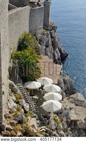 Bar Restaurant Clinging To The Side Of Castle Walls. Dubrovnik, Croatia.