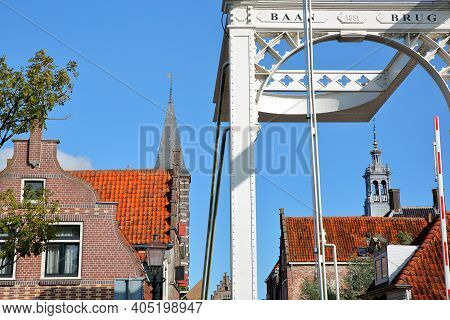 The Drawbridge Baanbrug With Historic Houses And The Spire Of The Stadhuis (town Hall) In The Backgr