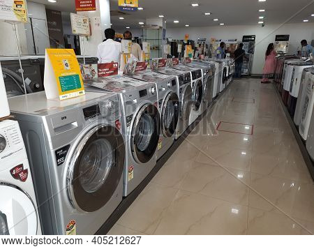 Closeup Of New Washing Machine, Mobile, Steamed Iron Box In A Girias Electronics Showroom At Gokul E