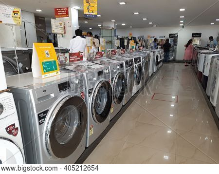 Closeup Of New Washing Machine, Mobile, Steamed Iron Box In A Girias Electronics Showroom At Gokul E