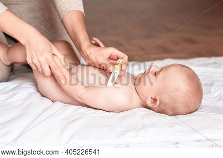 Boy Sick, Fever. Taking Child's Temperature To Measure, How High Of Body Temperature Woman's Hand Ho