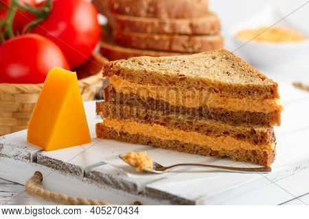 Delicious Sandwiches With Cheddar Cheese, Tomatoes And Onions On Wholewheat Rye Bread With Flax Seed