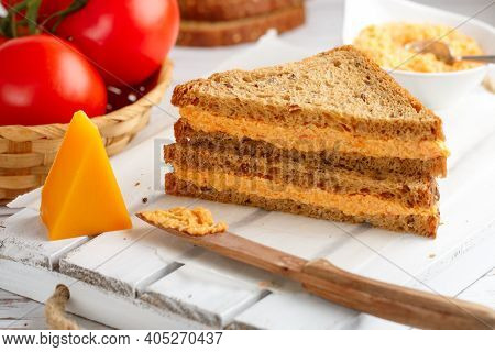 Delicious Sandwiches With Cheddar Cheese, Tomatoes And Onions On Wholewheat Rye Bread With Flax Seed