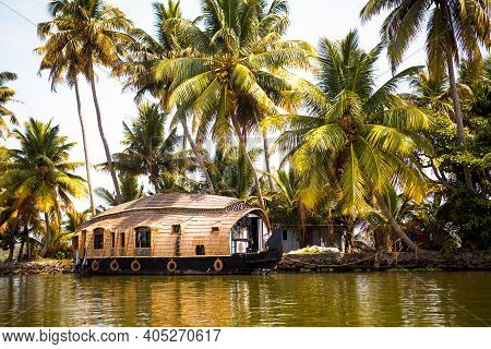 House-boat Pleasure Cruise Ship In India, Kerala On The Seaweed-covered River Channels Of Allapuzha 